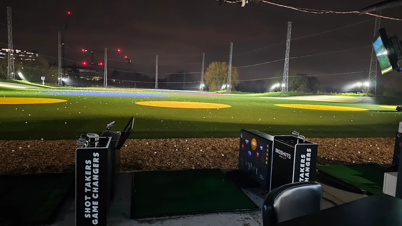 Night view of driving range in Harrow