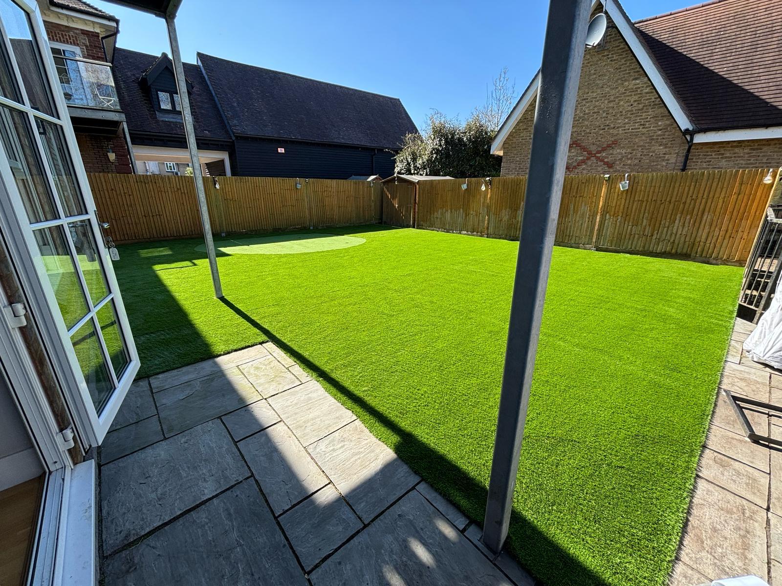 Modern garden with putting green in Hertfordshire