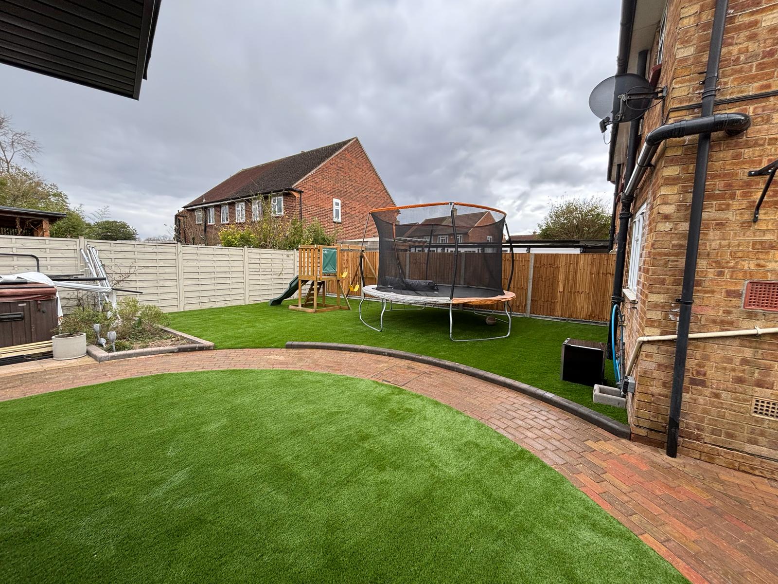 Family garden with play area in Epsom
