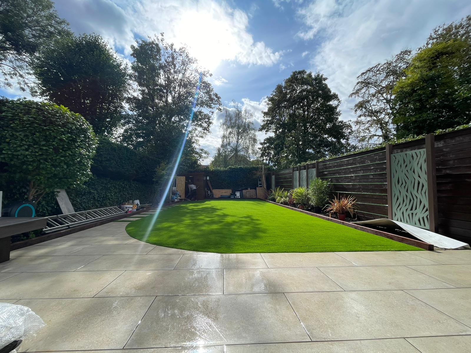 Modern garden with decorative fencing in Finchley