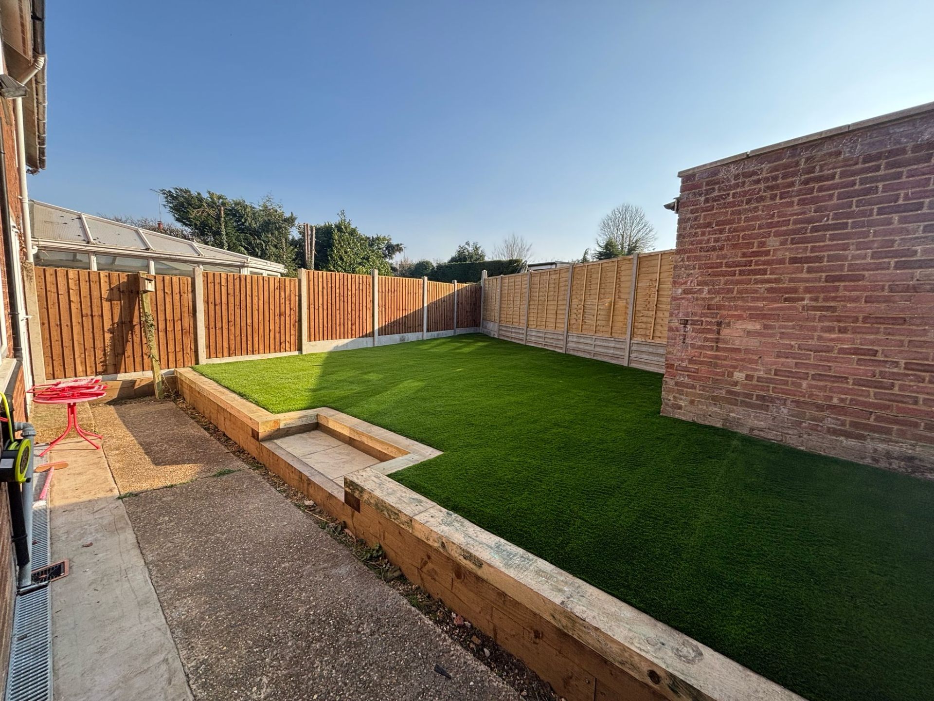 Raised lawn with sleeper border in St Albans