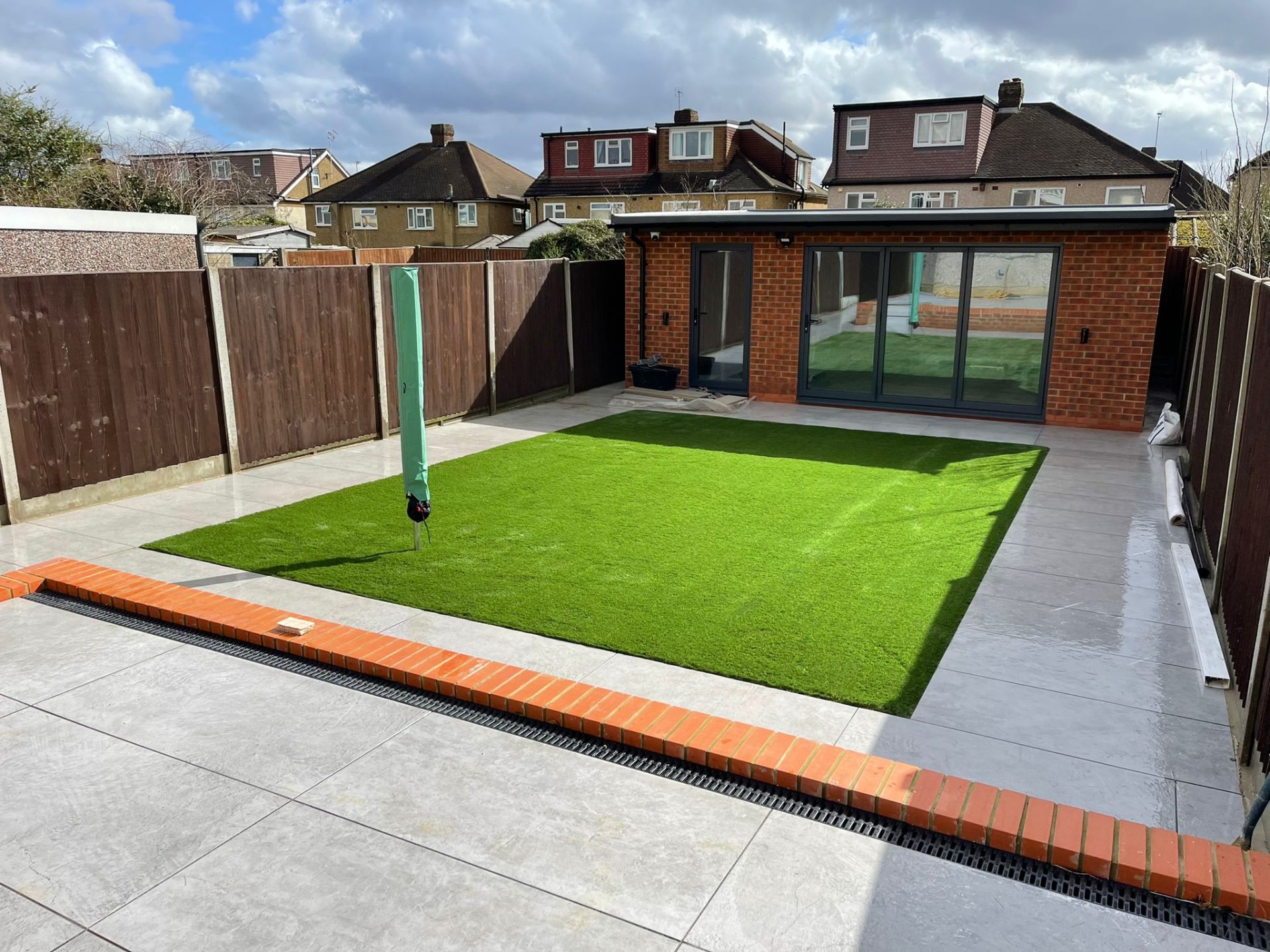 Modern extension garden with patio in Watford