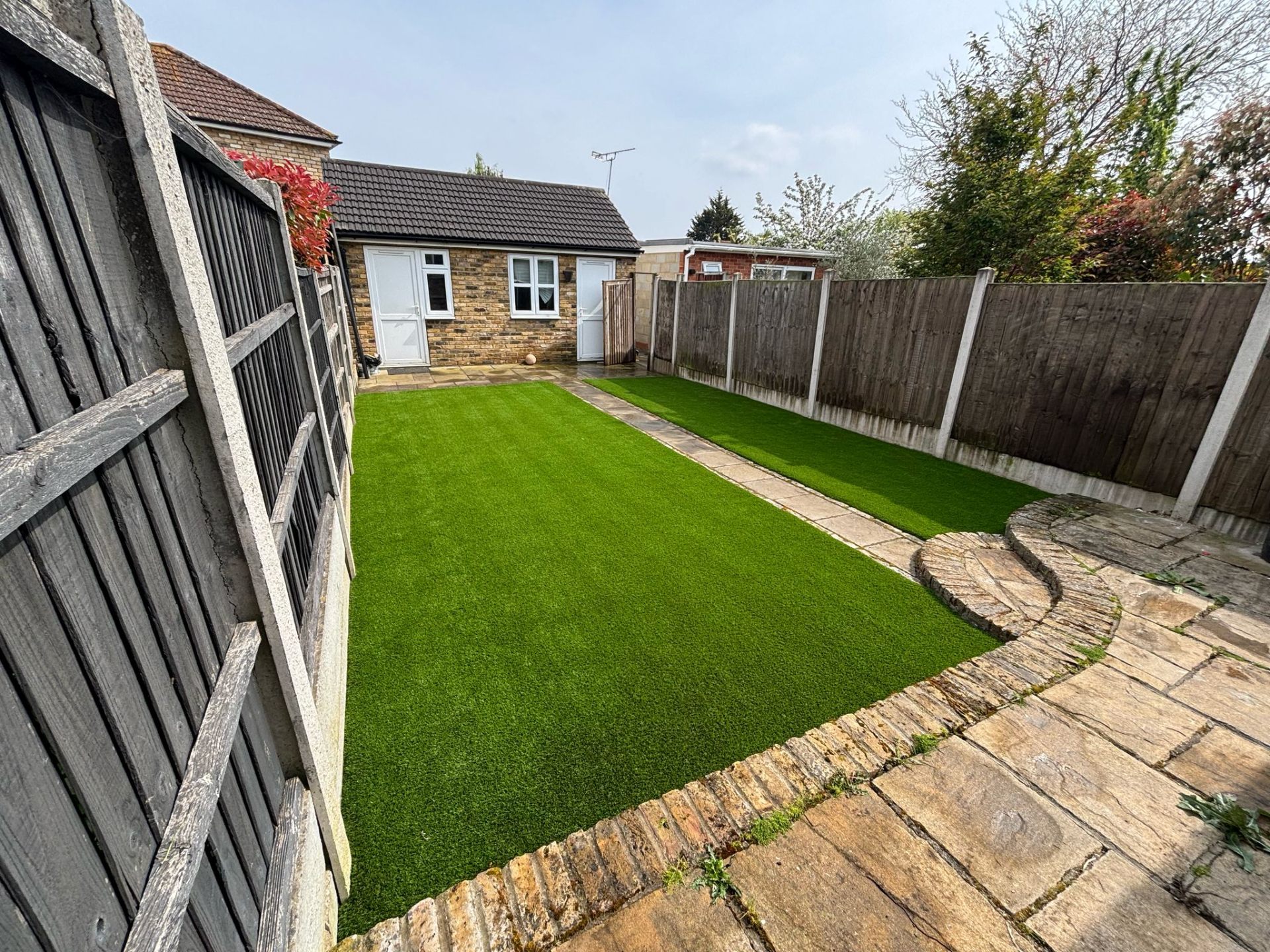 Bungalow garden with curved patio in Wembley